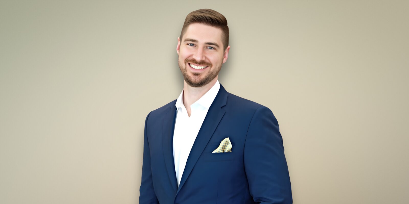 Patrick Melton, CEO of Inherited Home Helpers, smiling confidently in a blue suit with a pocket square.