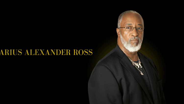 Portrait of Darius Alexander Ross in a black suit against a dark background with his name in gold text.