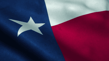 Close-up of the Texas state flag featuring blue, white, and red sections with a star