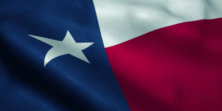 Close-up of the Texas state flag featuring blue, white, and red sections with a star