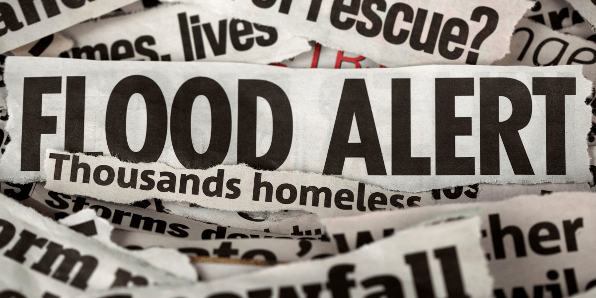 Flood alert headline displayed on torn newspaper clippings.