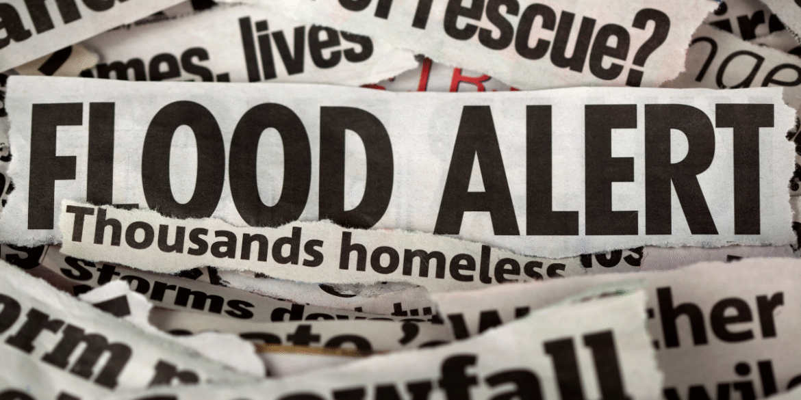 Flood alert headline displayed on torn newspaper clippings.